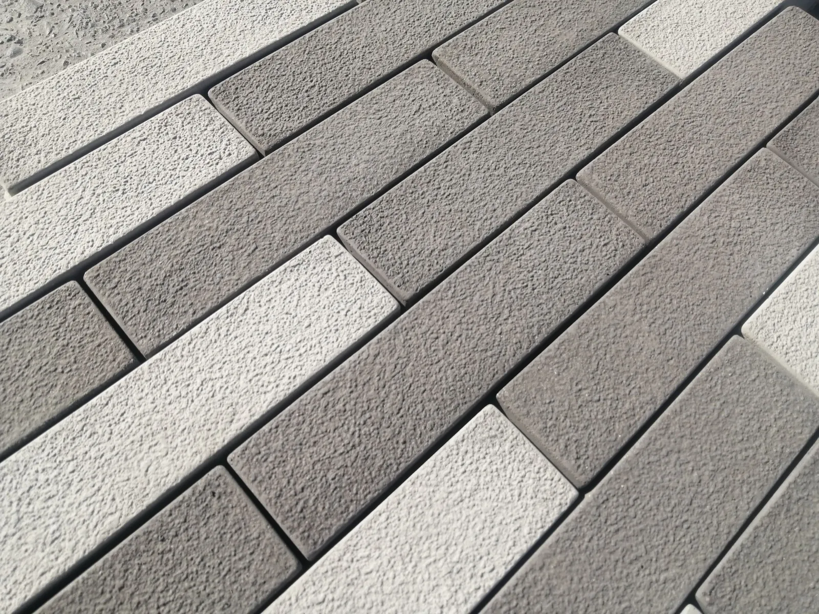 CAPECAST paving textures — charcoal and grey finishes